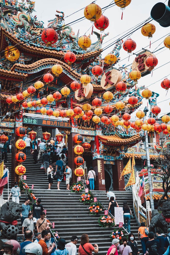 A vibrant scene of a traditional temple decorated with colorful lanterns during a festival in New Taipei City.